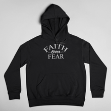 Load image into Gallery viewer, Wear this Hoodie with assurance, wear it like you mean it, wear it like you believe it, and be an inspiration. Faith Over Fear unisex Hoodie Classic Hoodie, fits both men and women (women consider choosing a size down if a more fitted look is desired) Soft and lightweight, with front pocket pouch, comfortable and flattering for all. 65% ring spun cotton, 35% polyester For Print Care: wash cold, turn inside out, gentle cycle mild detergent, no fabric softener
