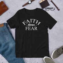 Load image into Gallery viewer, Wear this T-shirt with assurance, wear it like you mean it, wear it like you believe it, and be an inspiration. Faith Over Fear unisex t-shirt Classic t-shirt, fits both men and women (women consider choosing a size down if a more fitted look is desired) Soft and lightweight, with the right amount of stretch, comfortable and flattering for all. Pre-shrunk fabric, 100% combed and ring spun cotton For Print Care: wash cold, turn inside out, gentle cycle mild detergent, no fabric softener